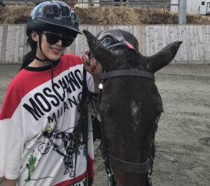 Corporate client smiling after their team building polo experience